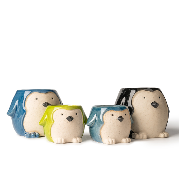 Portacandele in ceramica a forma di pinguino: adorabile e accogliente arte con luci e ombre